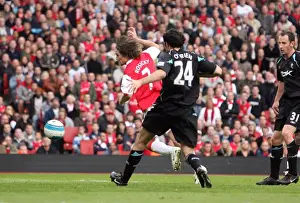 Tomas Rosicky scores Arsenals 2nd goal under pressure from Joey O Brien (Bolton)