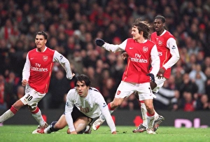 Tomas Rosicky scores Arsenals 3rd goal watched Jeremie Aliadiere and Emmanuel Adebayor as Ricardo Rocha (Tottenham) looks on. Arsenal 3: 1 Tottenham Hotspur. Carling Cup Semi Final 2nd Leg. Emirates Stadium, 31 / 1 / 07. Credit: Arsenal Football Club /