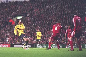 Tomas Rosicky shoots past Liverpool captain Steven Gerrard to score the 1st Arsenal goal