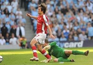 Manchester City v Arsenal 2009-10 Collection: Tomas Rosicky shoots past Man City goalkeeper Shay