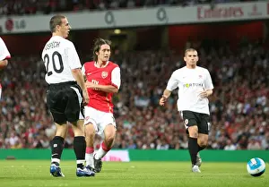 Tomas Rosicky shoots past Sparta Prague goalkeeper Tomas Postulka to score the 1st Arsenal goal