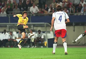 Hamburg V Arsenal 2006-7 Prints: Tomas Rosicky shoots past substitute goalkeeper Stefan Wachter to score the 2nd Arsenal goal
