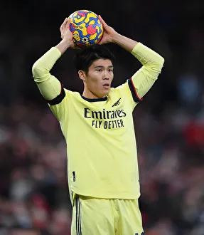 Manchester United V Arsenal 2020-21 Prints: Tomiyasu Stands Firm: Arsenal's Defensive Hero at Old Trafford vs Manchester United (Premier League 2020-21)