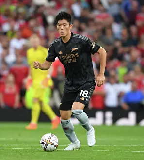 Manchester United V Arsenal 2022-23 Prints: Tomiyasu Stands Firm: Arsenal's Defensive Hero at Old Trafford vs