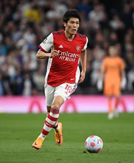 Tottenham Hotspur V Arsenal 2021-22 Prints: Tomiyasu vs. Tottenham: Intense Rivalry Clash - Arsenal's Star Defender Faces Off in Premier League Showdown