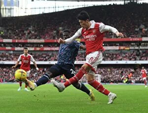 Arsenal v Nottingham Forest 2022-23 Collection: Tomiyasu's Game-Winning Sprint: Arsenal Outpaces Nottingham Forest