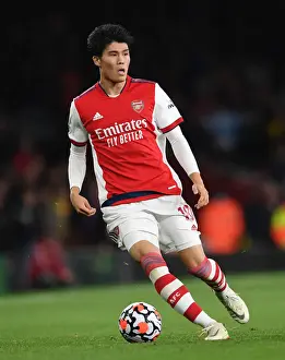 Arsenal V Crystal Palace 2021-22 Prints: Tomiyasu's Standout Performance: Arsenal Triumphs Over Crystal Palace in Premier League 2021-22