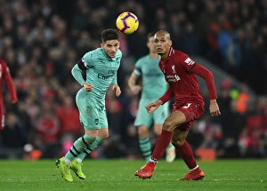 Images Dated 29th December 2018: Torreira vs. Fabinho: A Heading Battle at Anfield - Liverpool vs. Arsenal (2018-19)