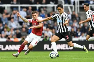 Newcastle United V Arsenal 2018-19 Prints: Torreira vs Muto: A Fierce Battle in Newcastle United vs Arsenal FC Premier League Clash - The Duel at St