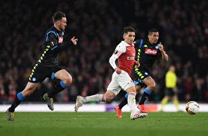 Arsenal v SSC Napoli 2018-19 Collection: Torreira vs. Ruiz: A Midfield Battle in Arsenal's Europa League Clash against Napoli