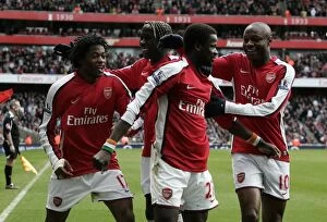 Arsenal v Burnley FA Cup 2008-9 Collection: Triumphant Moment: Arsenal's Eboue, Gallas, and Song Celebrate 3rd Goal vs. Burnley in FA Cup