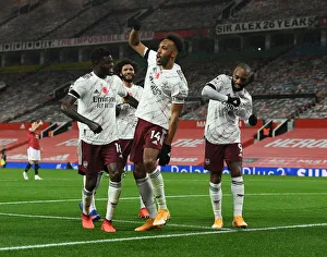 Triumphant Threesome: Aubameyang, Partey, and Lacazette's Goal Celebration at Empty Old Trafford (Manchester United vs Arsenal, 2020-21)