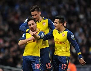 Images Dated 18th January 2015: Triumphant Threesome: Cazorla, Giroud, Sanchez - Arsenal's Goal Celebration vs. Manchester City