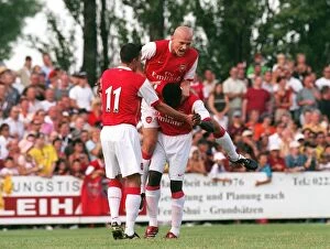 Schwadorf v Arsenal 2006-07 Collection: Triumphant Threesome: Kolo Toure, Pascal Cygan, and Robin van Persie Celebrate Arsenal's