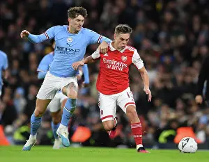 Manchester City V Arsenal 2022-23 Prints: Trossard vs. Stones: Clash of the Titans - Manchester City vs