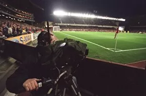 Arsenal v Villarreal 2005-6 Gallery: A TV Cameraman works under the floodlights which are on for the last time