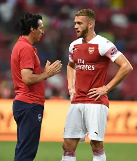 Unai Emery Engages with Calum Chambers during Arsenal's Clash against Atletico Madrid, 2018 International Champions Cup, Singapore