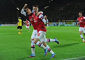 Borussia Dortmund V Arsenal 2013-14 Prints: Unforgettable: Ramsey and Ozil's Euphoric Goal Celebration at Borussia Dortmund