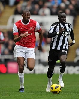 Newcastle United v Arsenal 2010-11 Collection: Unforgettable Rivalry: Diaby vs. Tiote in the Intense 4-4 Draw between Newcastle and Arsenal