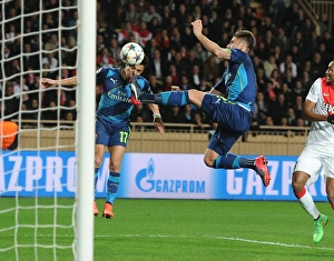 Monaco V Arsenal 2014/15 Prints: Unintended Clash: Giroud Kicks Sanchez in Monaco vs. Arsenal UCL Showdown