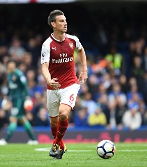 Images Dated 17th September 2017: Unwavering Focus: Laurent Koscielny's Intense Concentration in the Chelsea-Arsenal Rivalry (2017-18)