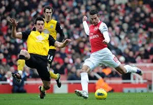 Images Dated 4th February 2012: Van Persie vs Dann: Intense Moment at the Emirates - Arsenal v Blackburn Rovers