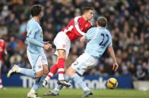 Manchester City v Arsenal 2008-09 Collection: Van Persie vs. Dunne: Manchester City's 3-0 Victory Over Arsenal in the Barclays Premier League