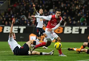 Van Persie vs. Wheater: Intense Battle at the Reebok Stadium - Arsenal vs. Bolton Wanderers, Premier League 2011-12
