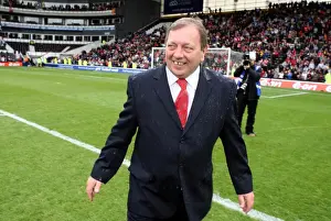Vic Akers the Arsenal Ladies Manager is covered in champagne