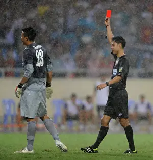 Vietnam V Arsenal 2013-14 Prints: Vietnam Goalkeeper Tran Buu Ngoc Red-Carded by Referee Leow Thian Hoe in Arsenal Friendly