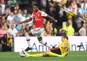 Watford vs Arsenal: Joe Willock Clashes with Craig Dawson in Premier League Showdown