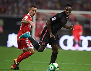 Bayern Munich V Arsenal 2017-18 Prints: Welbeck vs. Rafinha: Arsenal vs. Bayern Munich Pre-Season Showdown in Shanghai