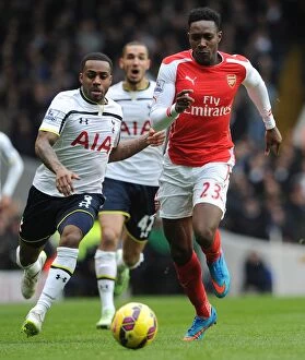 Tottenham Hotspur v Arsenal 2014-15 Collection: Welbeck vs. Rose: Intense Battle in the 2014-15 Tottenham vs. Arsenal Premier League Clash