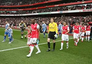William Gallas (Arsenal) and Graeme Murty (Reading) lead out the teams before the match