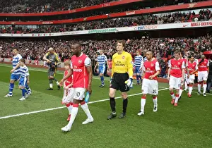 William Gallas (Arsenal) and Graeme Murty (Reading) lead out the teams before the match