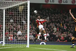 William Gallas heads over Hull City defender Andy Dawson