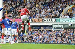 Everton v Arsenal 2009-10 Collection: William Gallas heads past Everton goalkeeper Tim Howard
