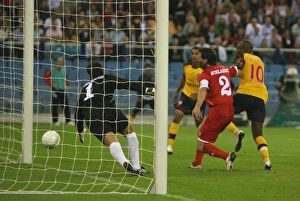 Images Dated 13th August 2008: William Gallas shoots past FC Twente goalkeeper Sander