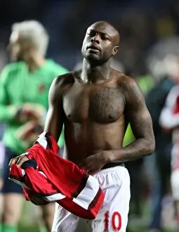 Images Dated 30th November 2008: William Gallas throws his shirt to the Arsenal fans after the match