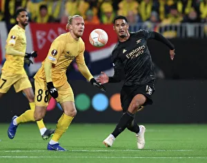 Bodø/Glimt V Arsenal 2022-23 Prints: William Saliba Clashes with Lars Salvesen: Arsenal vs