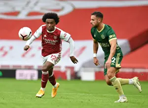 Willian Outmaneuvers Baldock: Arsenal's Win in Empty Emirates Stadium