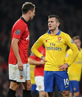 Manchester United V Arsenal 2013-14 Prints: Wilshere and Evans: A Moment of Respite Amidst Manchester United vs