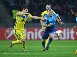 Wilshere vs. Dragun: A Europa League Battle - Arsenal's Jack Wilshere Takes on FC BATE Borisov's Stanislav Dragun