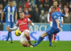 Wigan Athletic V Arsenal 2012-13 Prints: Wilshere vs Jones: Intense Battle in Wigan Athletic vs Arsenal Premier League Clash