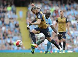 Manchester City V Arsenal 2105-16 Prints: Wilshere vs. Mangala: Clash of the Titans in Manchester City vs