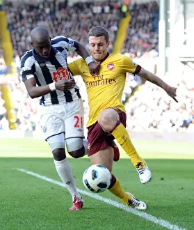 WBA V Arsenal 2010-11 Prints: Wilshere vs. Mulumbu: The Thrilling Stalemate at The Hawthorns