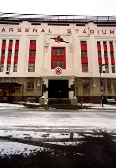Winter's Embrace: Arsenal Stadium in Snowy Highbury, London