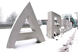 Winter's Embrace: Arsenal's Snow-Covered Emirates Stadium
