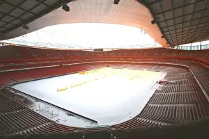 Winter's Embrace: Arsenal's Snow-Covered Emirates Stadium