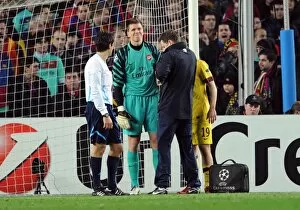 Images Dated 8th March 2011: Wojciech Szczesny (Arsenal) is treated by Colin Lewin Arsenal physio. Barcelona 3